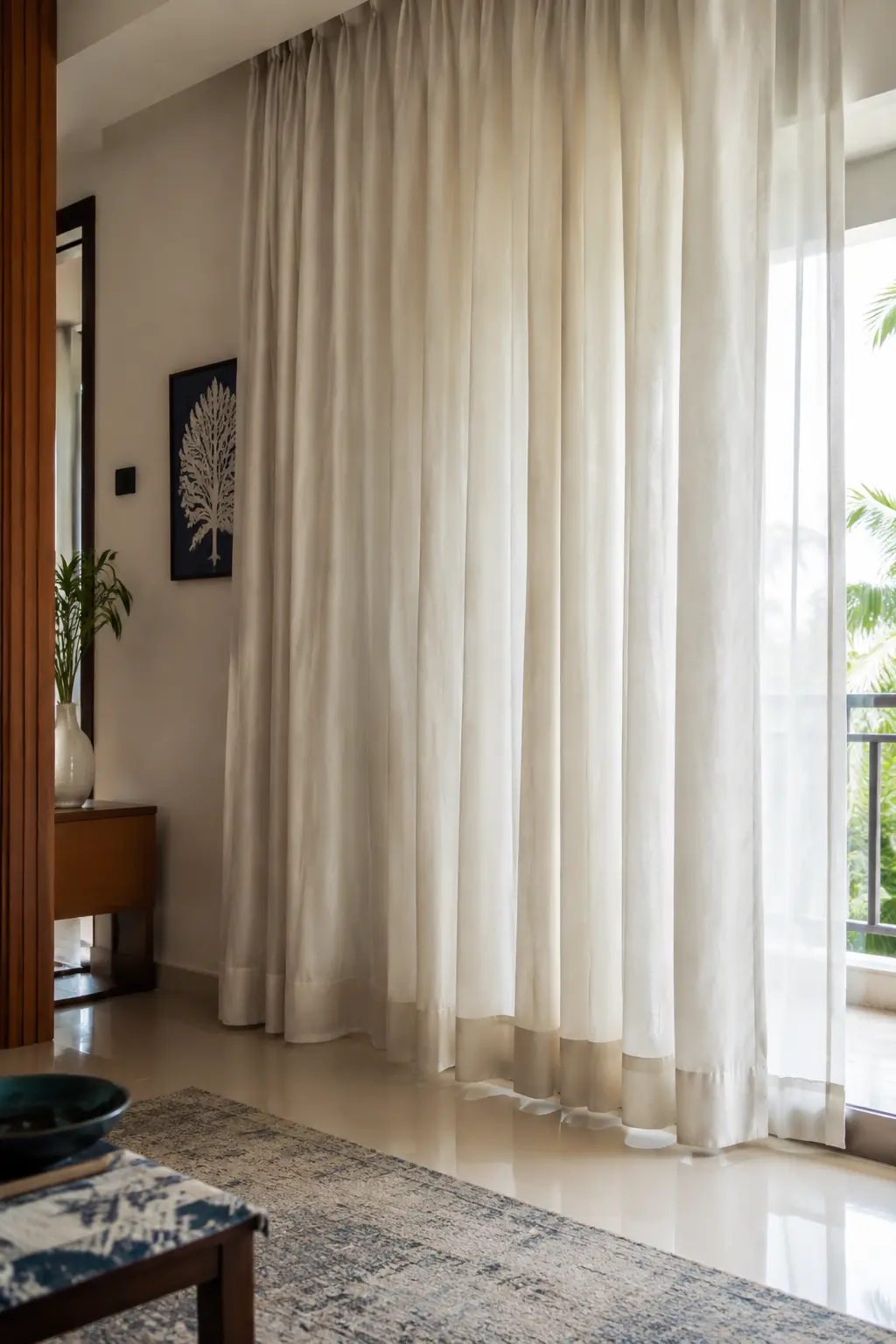 Floor-length curtains in a clean modern interior